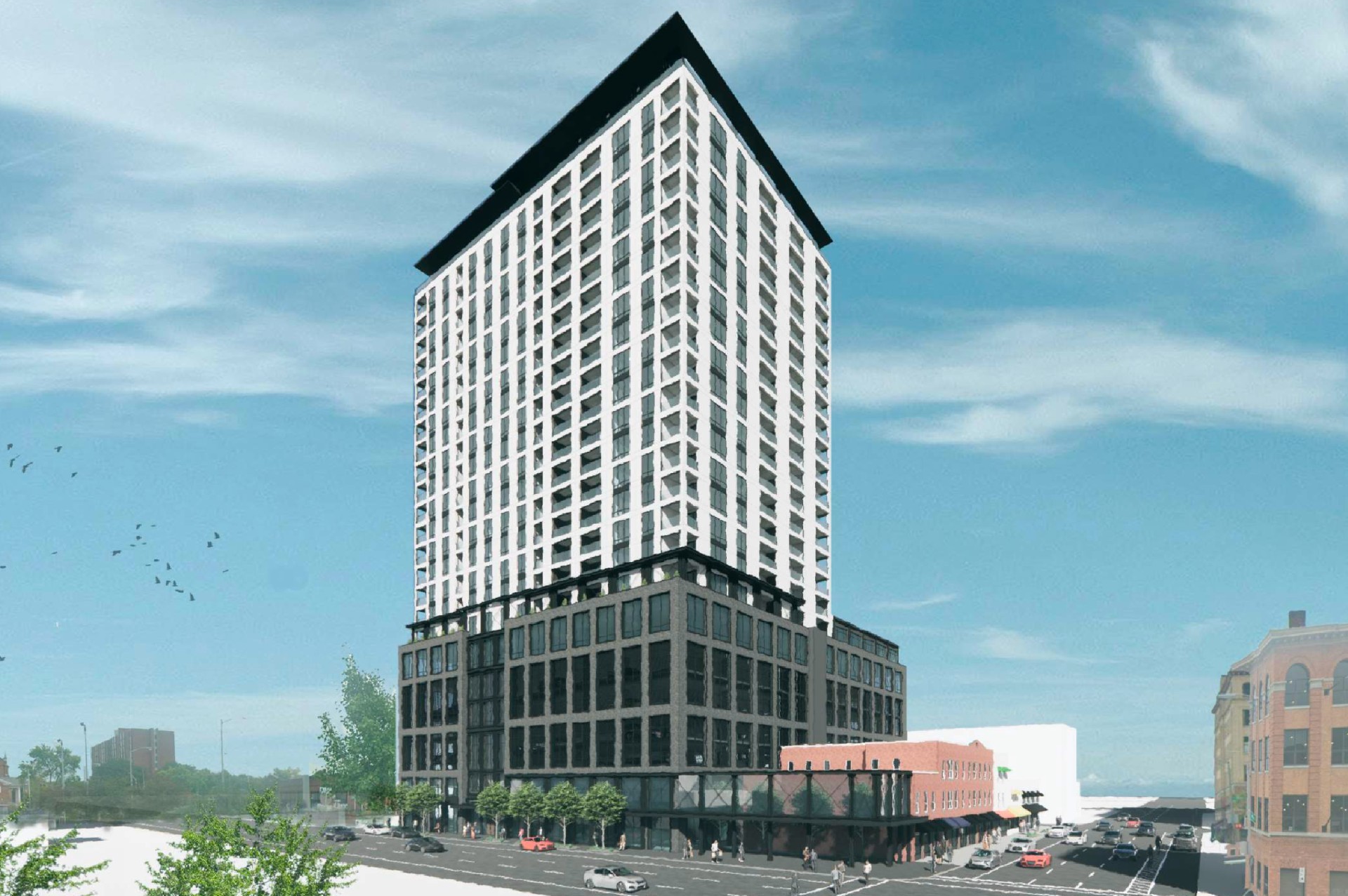 Perspective architectural rendering of The Estrella tower showing a multistory brick base beneath a high-rise residential structure in downtown Columbus.