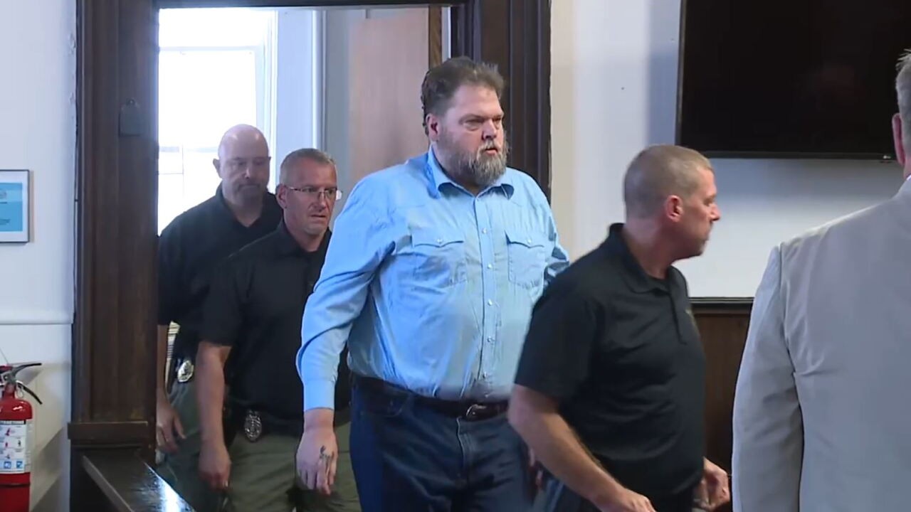 George 'Billy' Wagner III walks into a courtroom escorted by deputies.