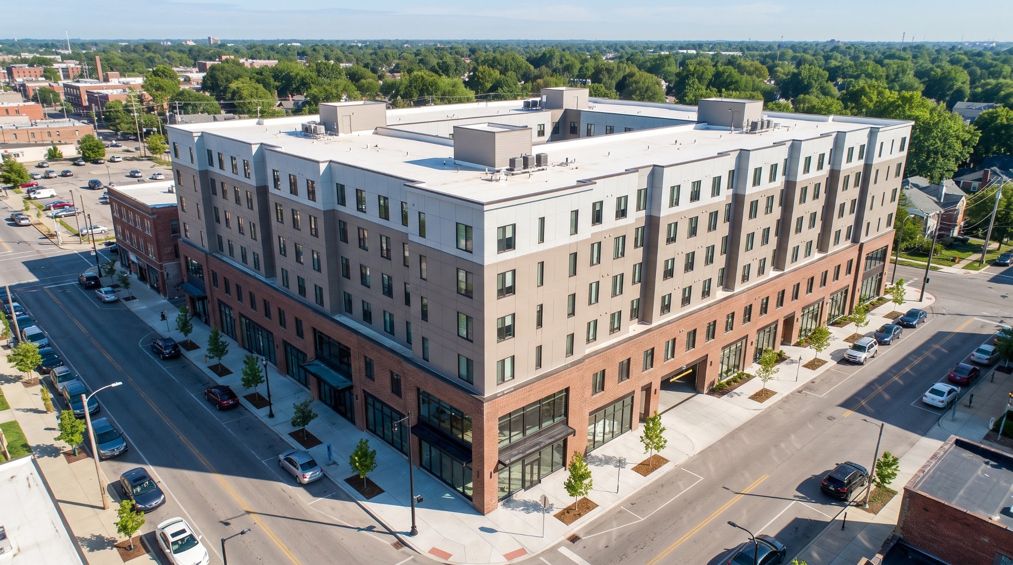Aerial view of a proposed seven-story mixed-use building at the corner of North High Street and East Woodruff Avenue.