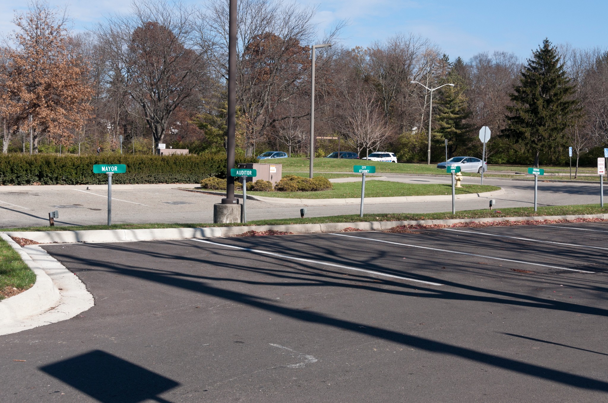 Reserved parking signs for Mayor, Auditor, and City Attorney at the Reynoldsburg City Hall parking lot.