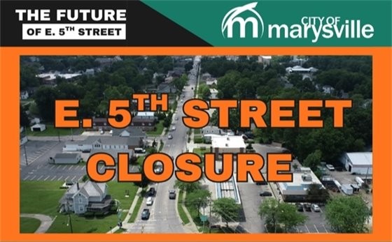 Graphic announcement featuring an aerial photograph looking down East 5th Street in Marysville, Ohio, with surrounding residential and commercial areas under a blue sky.